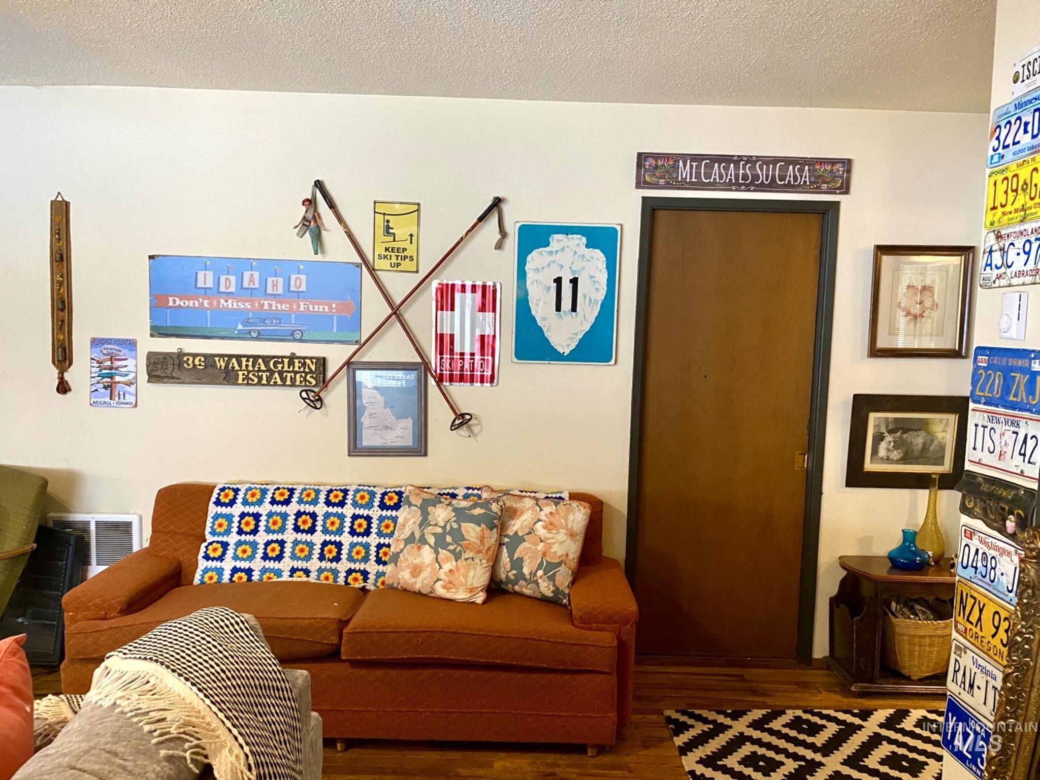 138 Timberline Drive Pierce, ID 83546 - Photo 4 of 28 Living room featuring a textured ceiling and wood finished floors