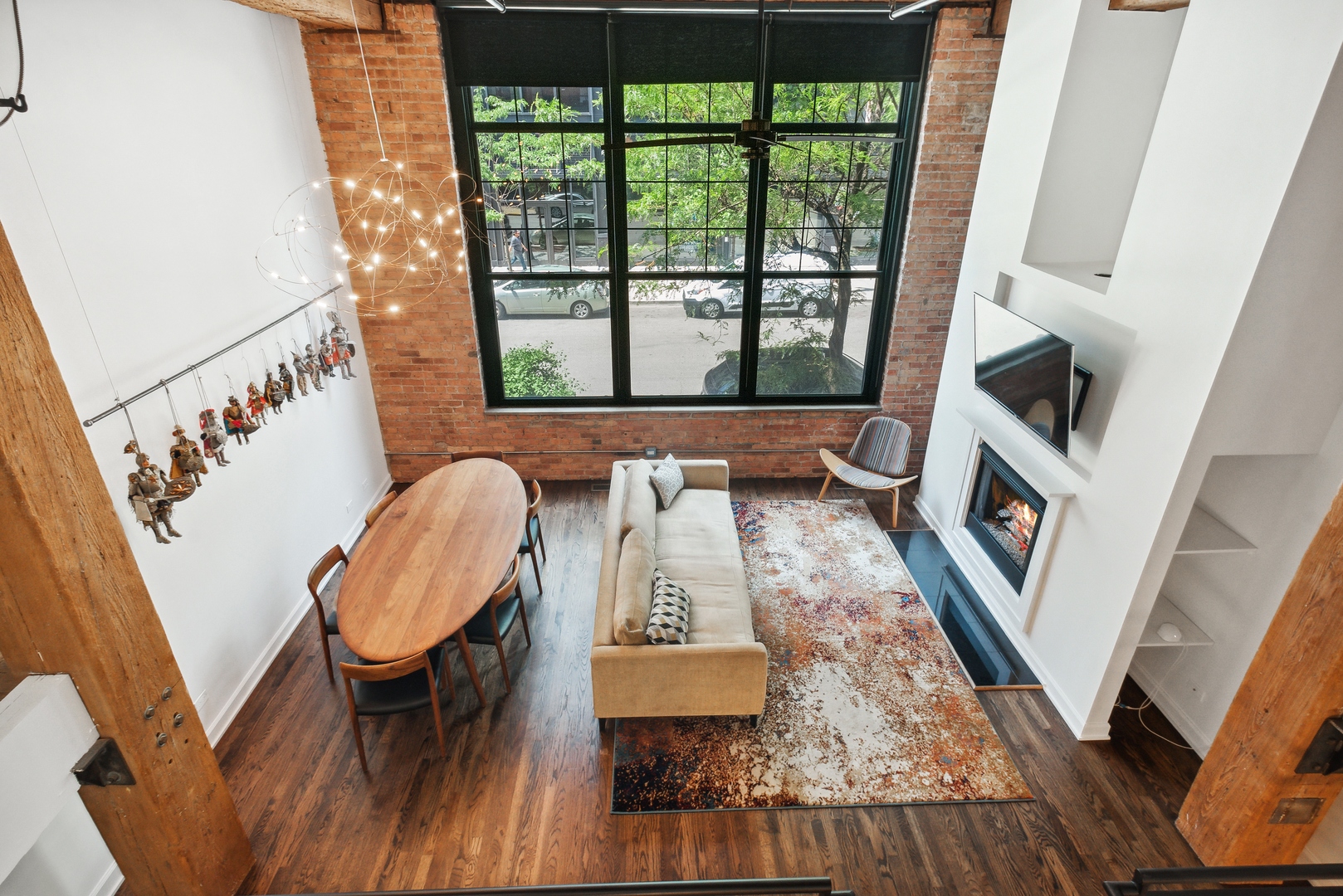 1000 West Washington Boulevard, Unit 148 Chicago, IL 60607 - Photo 5 of 18 a living room with furniture and a fireplace