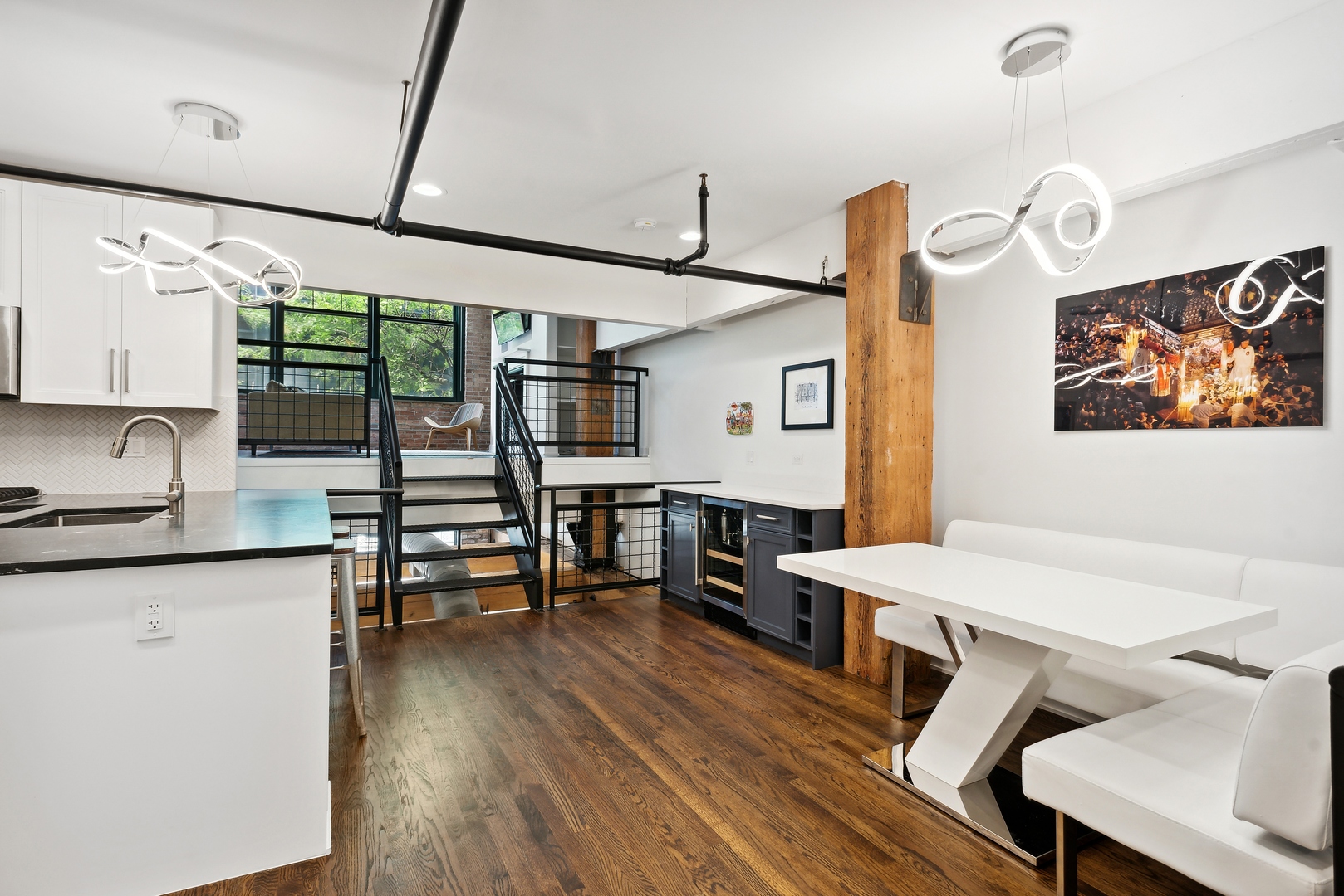 1000 West Washington Boulevard, Unit 148 Chicago, IL 60607 - Photo 6 of 18 a kitchen with stainless steel appliances granite countertop a sink and wooden floor