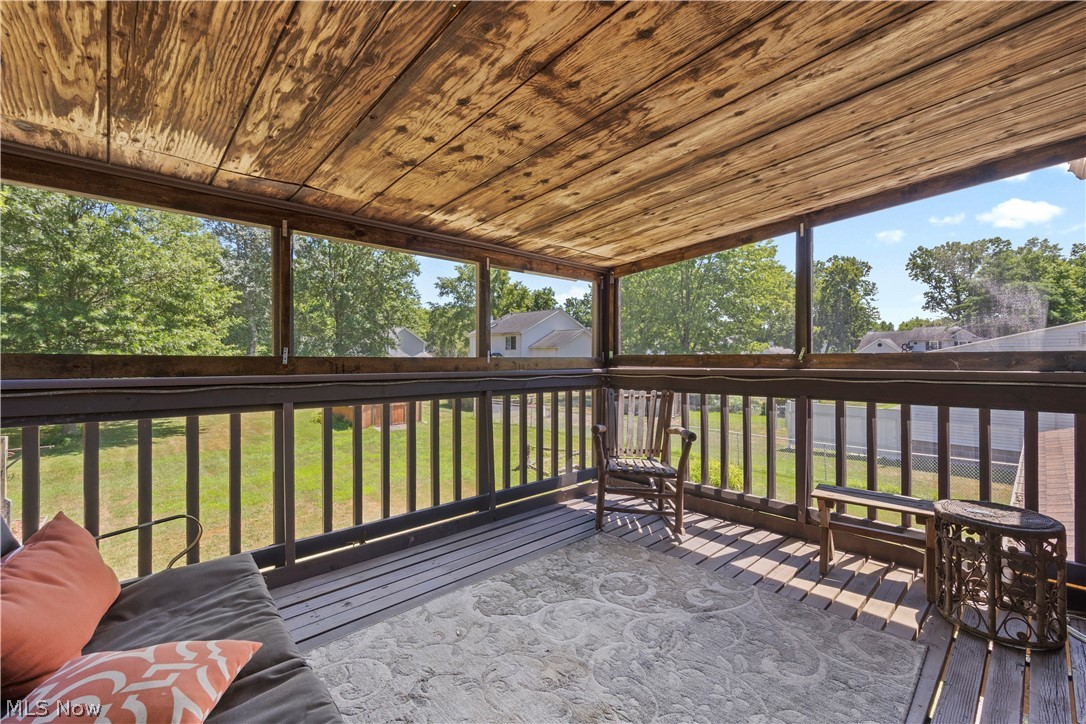 2565 Abbe Road North Sheffield Lake, OH 44054 - Photo 21 of 32 Covered balcony with screened enclosure
