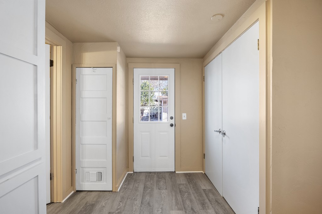 1200 North Street Kerrville, TX 78028 - Photo 12 of 50 a view of a hallway with wooden floor