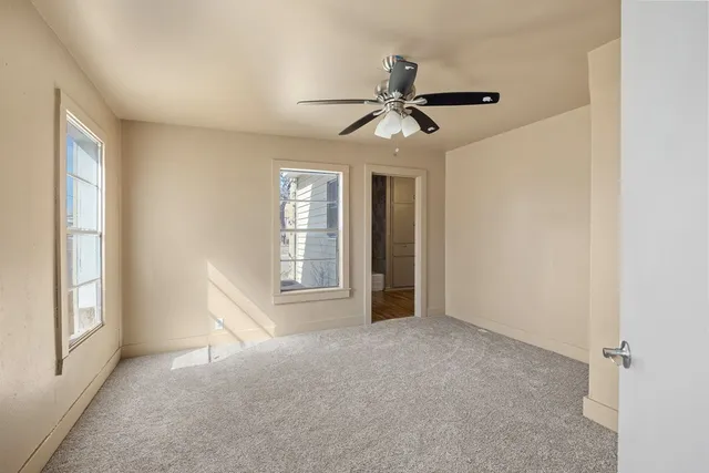 a bathroom with a toilet sink and shower