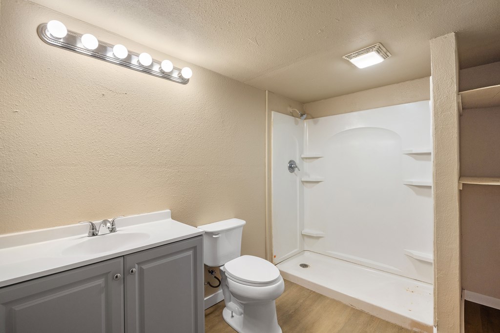 1200 North Street Kerrville, TX 78028 - Photo 22 of 50 a bathroom with a toilet sink and shower