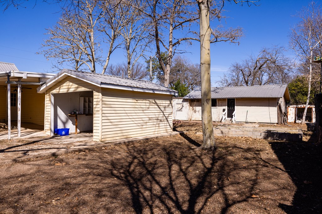 1200 North Street Kerrville, TX 78028 - Photo 27 of 50 a view of a house with a yard