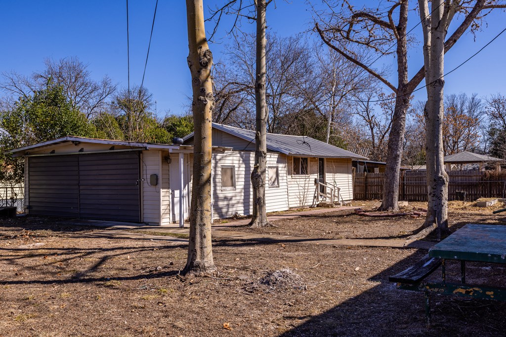 1200 North Street Kerrville, TX 78028 - Photo 34 of 50 a view of a house with trees next to a road