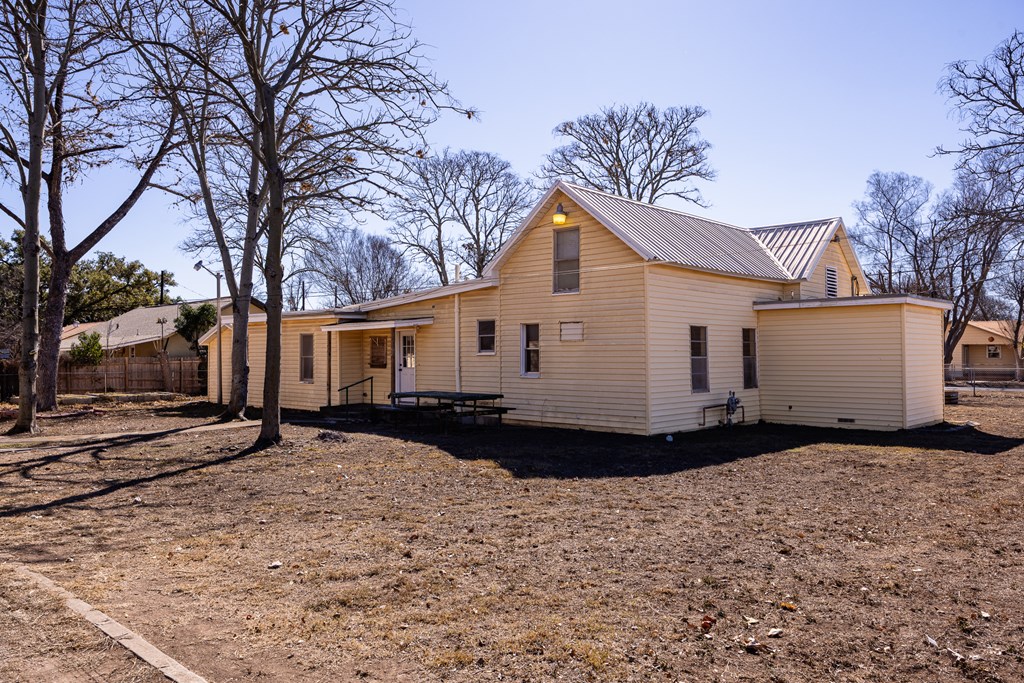 1200 North Street Kerrville, TX 78028 - Photo 36 of 50 a view of a white house with a yard