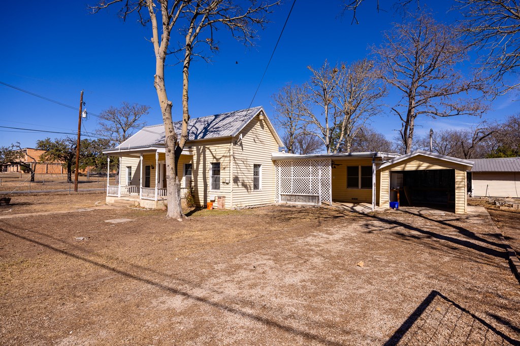 1200 North Street Kerrville, TX 78028 - Photo 8 of 50 a view of a house with a patio