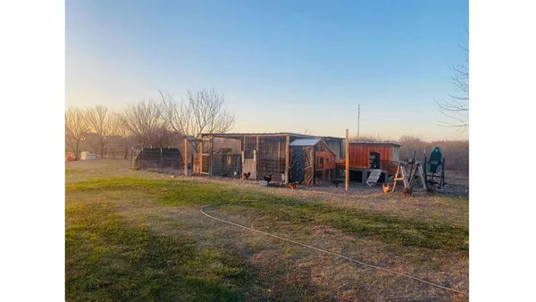 a view of a yard and a garage