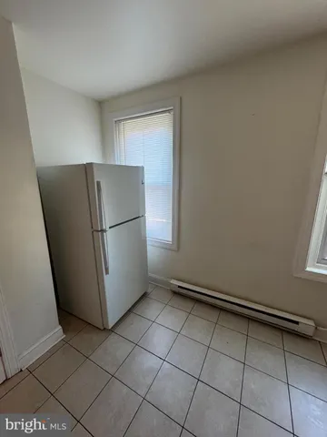 a view of a refrigerator in a kitchen