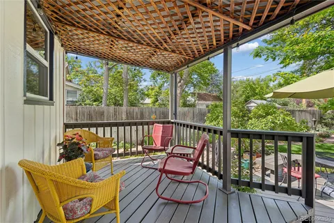 a view of a house with backyard sitting area and garden