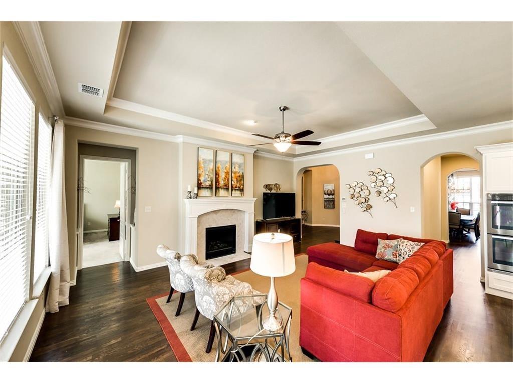 917 Pleasant View Drive Rockwall, TX 75087 - Photo 12 of 27 a living room with furniture and a fireplace