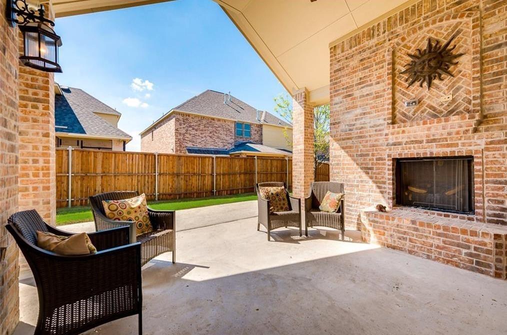 917 Pleasant View Drive Rockwall, TX 75087 - Photo 24 of 27 a outdoor space with patio couch and a fireplace
