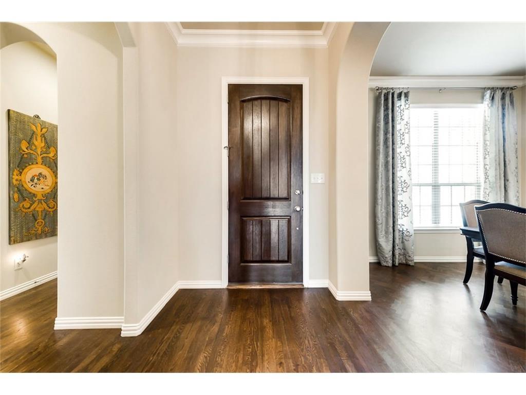 917 Pleasant View Drive Rockwall, TX 75087 - Photo 6 of 27 a view of empty room with wooden floor and kitchen
