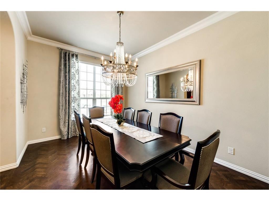 917 Pleasant View Drive Rockwall, TX 75087 - Photo 7 of 27 a dining room with furniture a chandelier and wooden floor