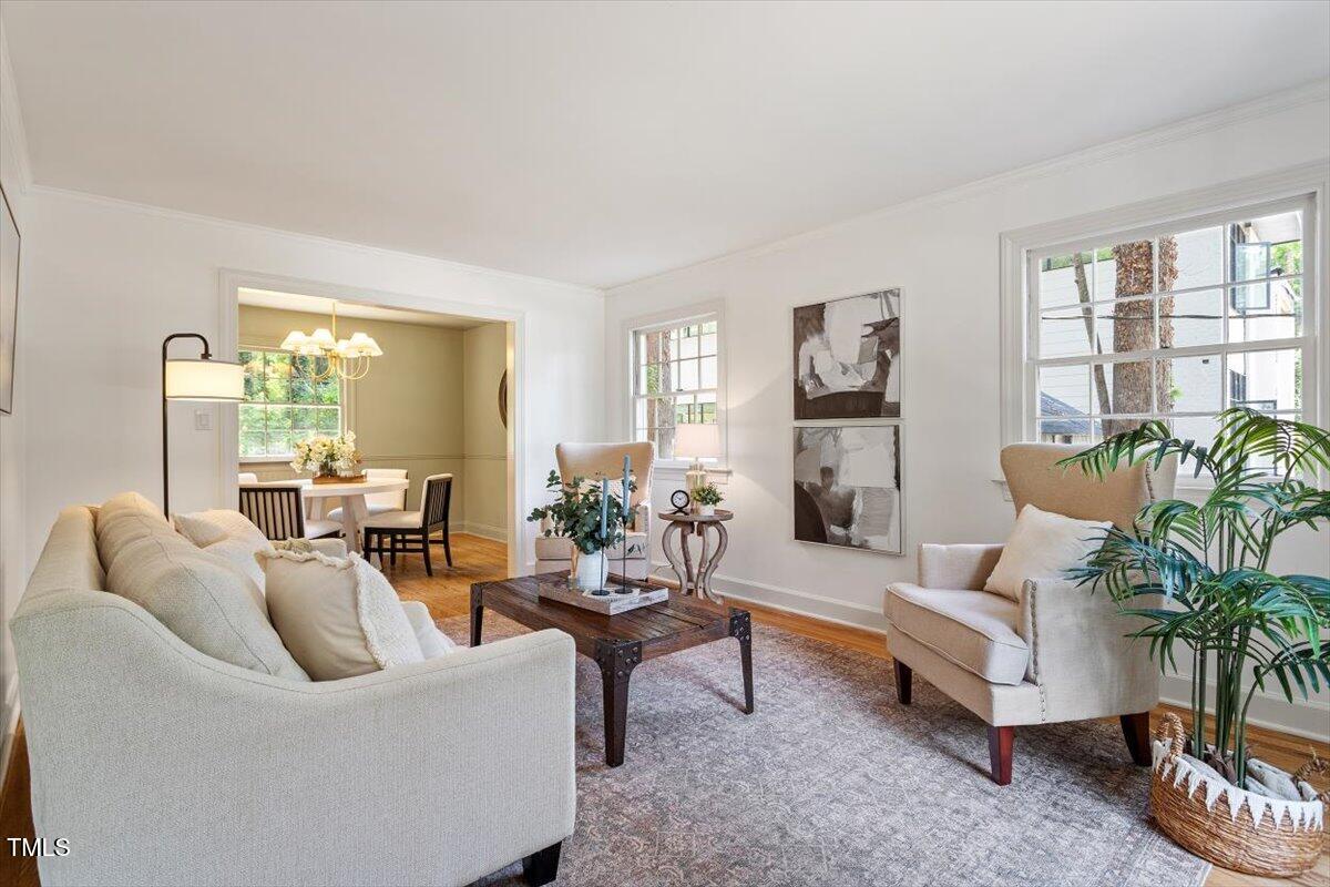 6311 Brandywine Road Raleigh, NC 27607 - Photo 11 of 21 a living room with furniture potted plant and a large window