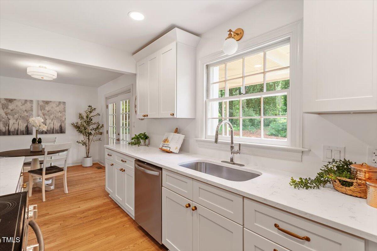 6311 Brandywine Road Raleigh, NC 27607 - Photo 4 of 21 a kitchen with a sink and cabinets