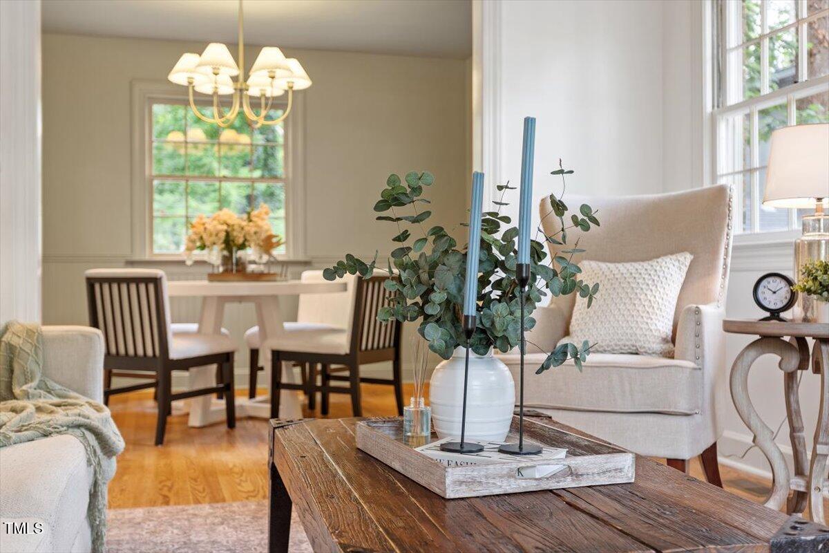 6311 Brandywine Road Raleigh, NC 27607 - Photo 10 of 21 a dining room with furniture potted plants and wooden floor