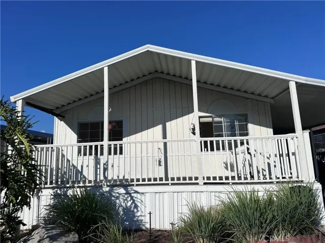 a view of a house with a small yard