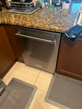 a close view of sink and granite counter top