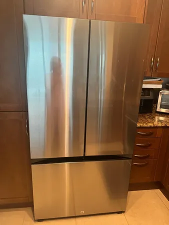 a view of a refrigerator in kitchen