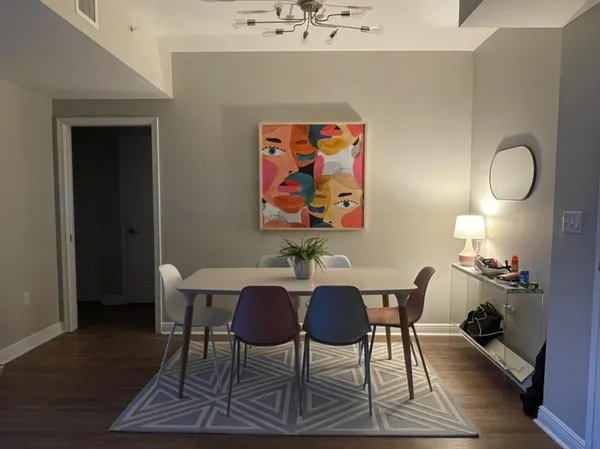 a view of a dining room with furniture and wooden floor