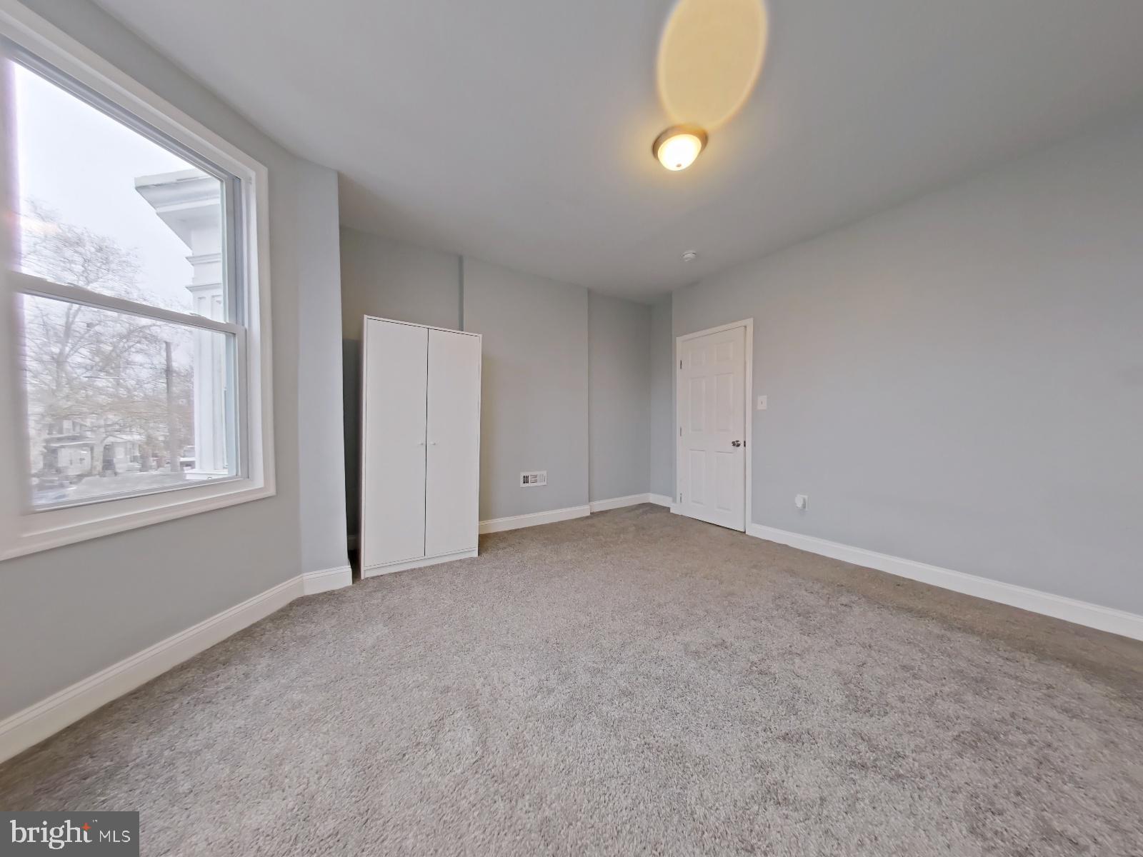 154 North 60th Street Philadelphia, PA 19139 - Photo 20 of 40 an empty room with windows and entrance