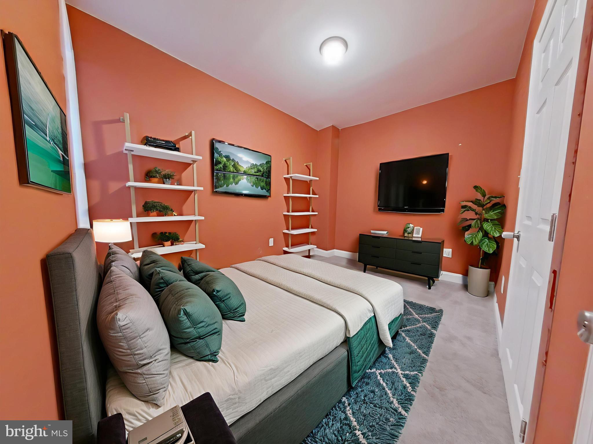 154 North 60th Street Philadelphia, PA 19139 - Photo 3 of 40 a bedroom with a bed and a flat screen tv