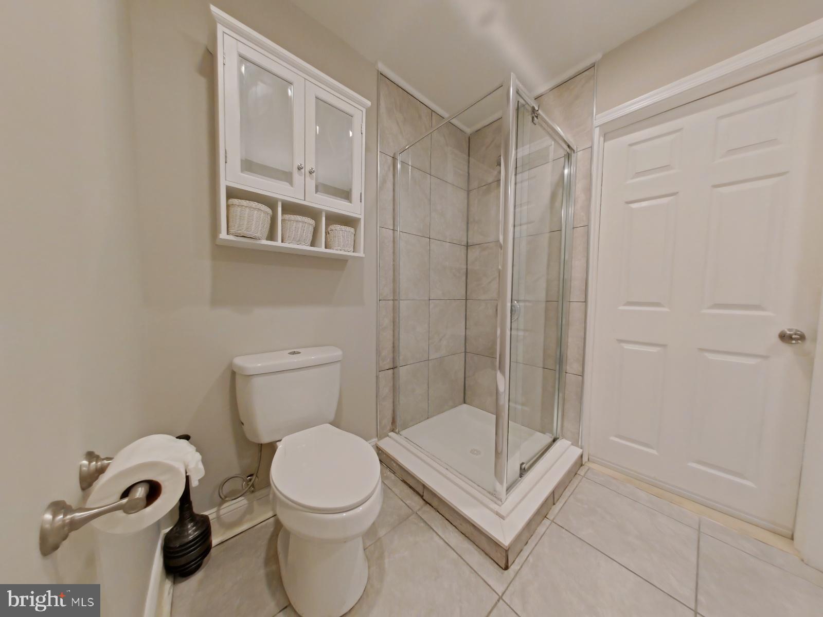154 North 60th Street Philadelphia, PA 19139 - Photo 33 of 40 a bathroom with a toilet and a shower