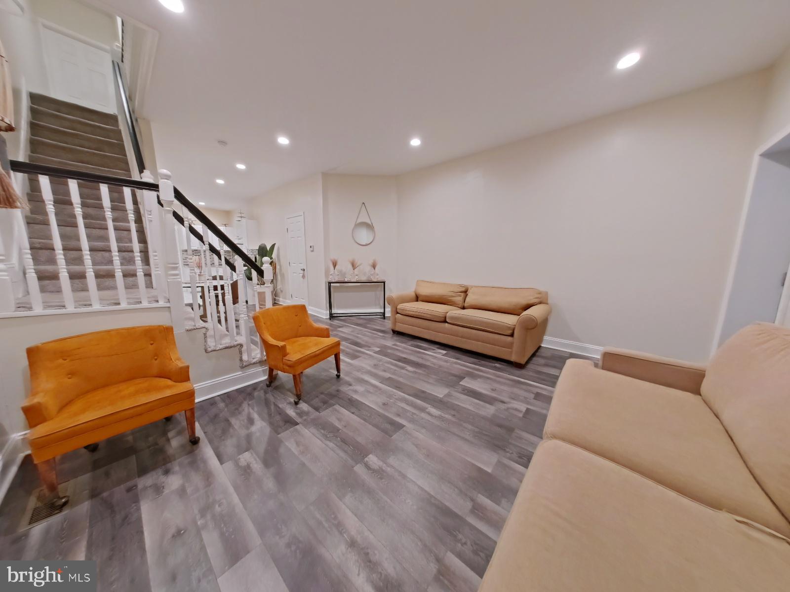 154 North 60th Street Philadelphia, PA 19139 - Photo 10 of 40 a living room with furniture and a wooden floor