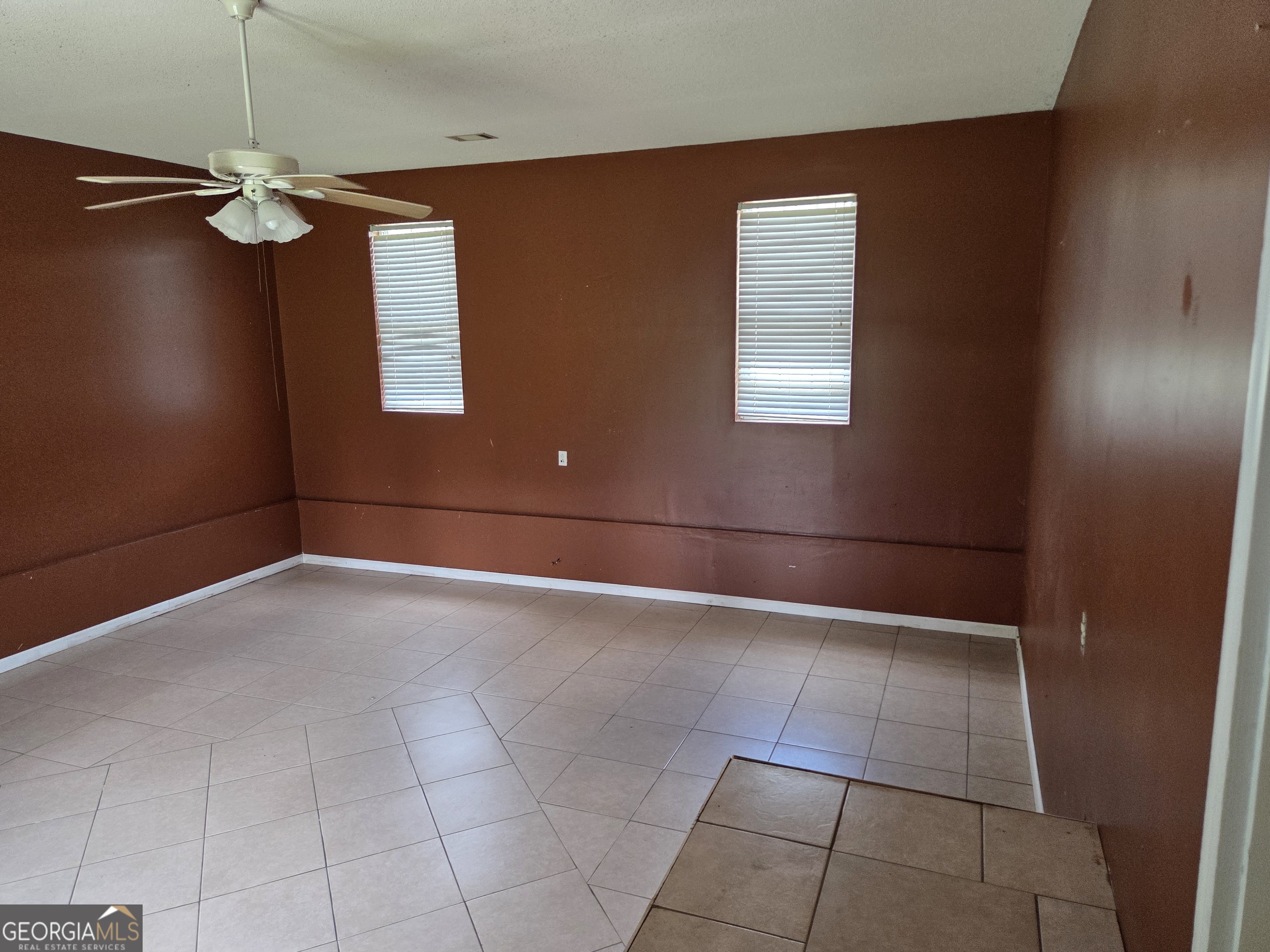 9546 Union Road Metter, GA 30439 - Photo 21 of 45 a view of a livingroom with a ceiling fan and window