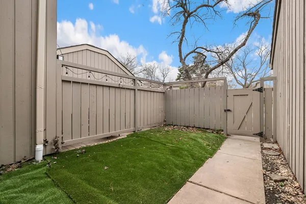a kitchen with stainless steel appliances a refrigerator a stove top oven a sink and dishwasher