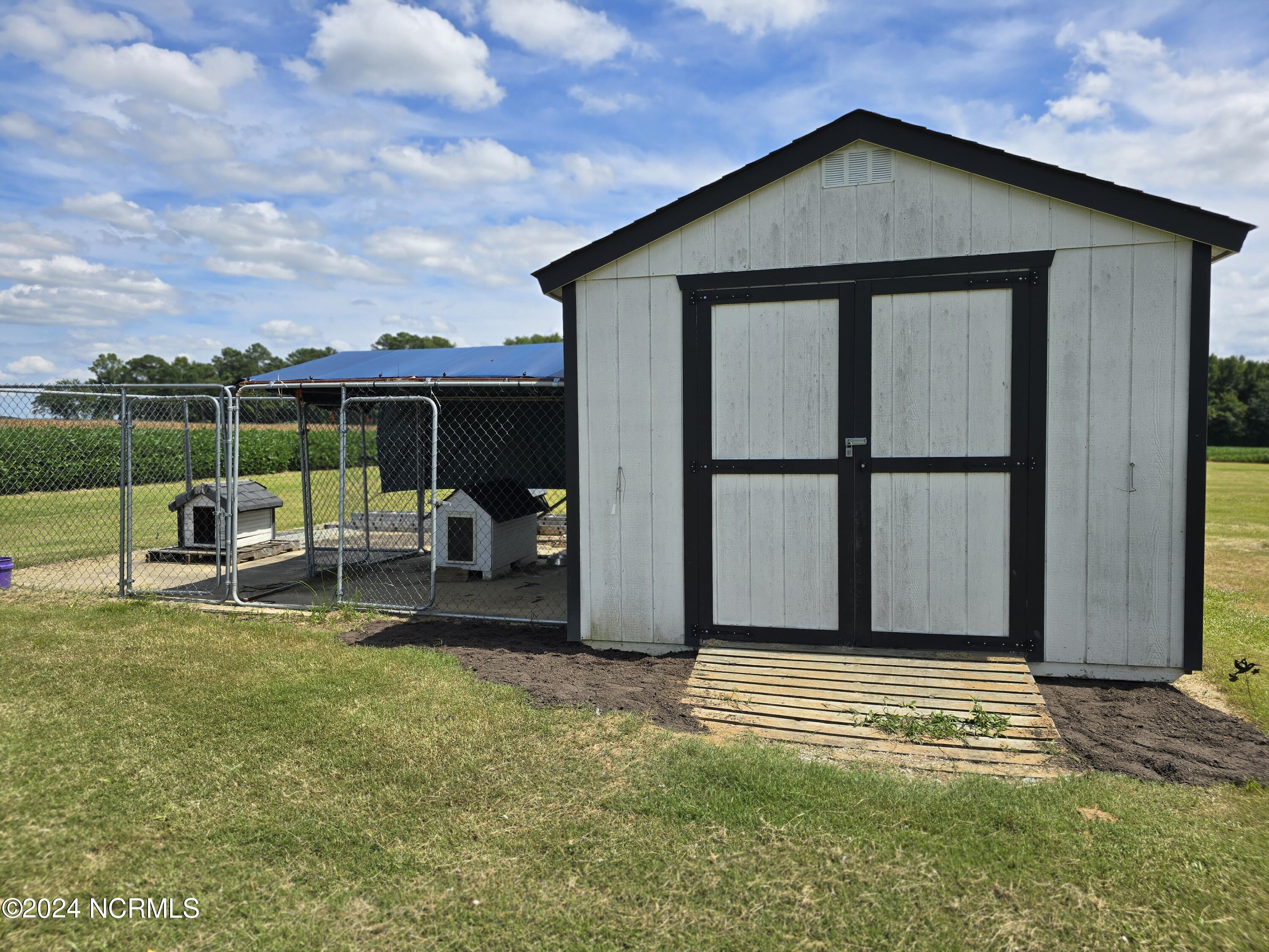 280 Turnpike Road Belvidere, NC 27919 - Photo 23 of 23 Shed with attached Dog Pen