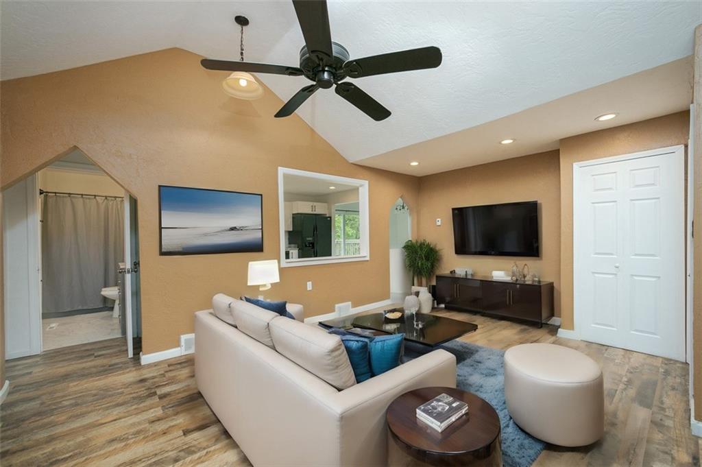103 McJunkin Road Pittsburgh, PA 15239 - Photo 11 of 24 a living room with furniture and a flat screen tv