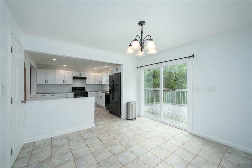 103 McJunkin Road Pittsburgh, PA 15239 - Photo 15 of 24 a view of a kitchen with furniture and stainless steel appliances