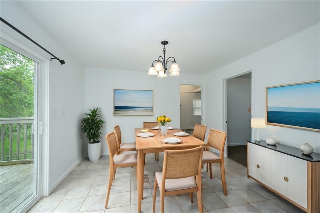 103 McJunkin Road Pittsburgh, PA 15239 - Photo 16 of 24 a dining room with a wooden table and chairs