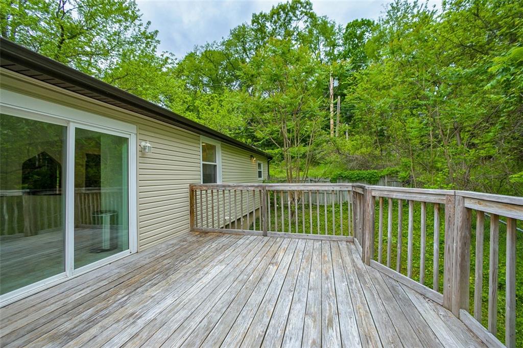 103 McJunkin Road Pittsburgh, PA 15239 - Photo 23 of 24 a balcony with wooden floor and fence