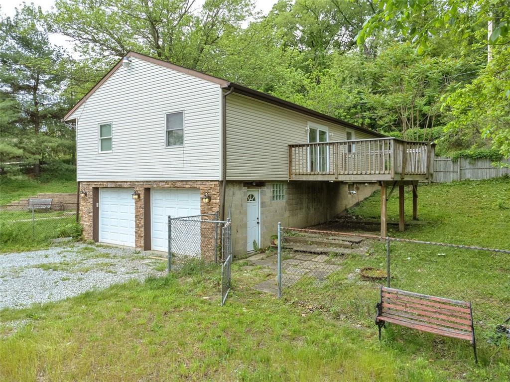 103 McJunkin Road Pittsburgh, PA 15239 - Photo 5 of 24 a backyard of a house with table and chairs