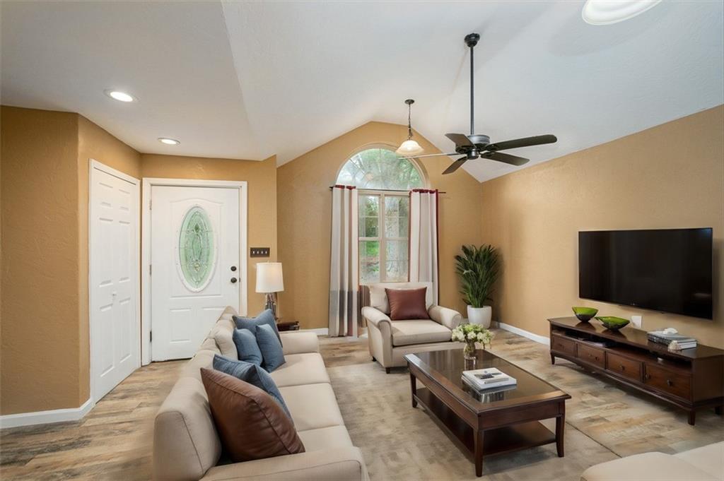 103 McJunkin Road Pittsburgh, PA 15239 - Photo 10 of 24 a living room with furniture a flat screen tv and a window