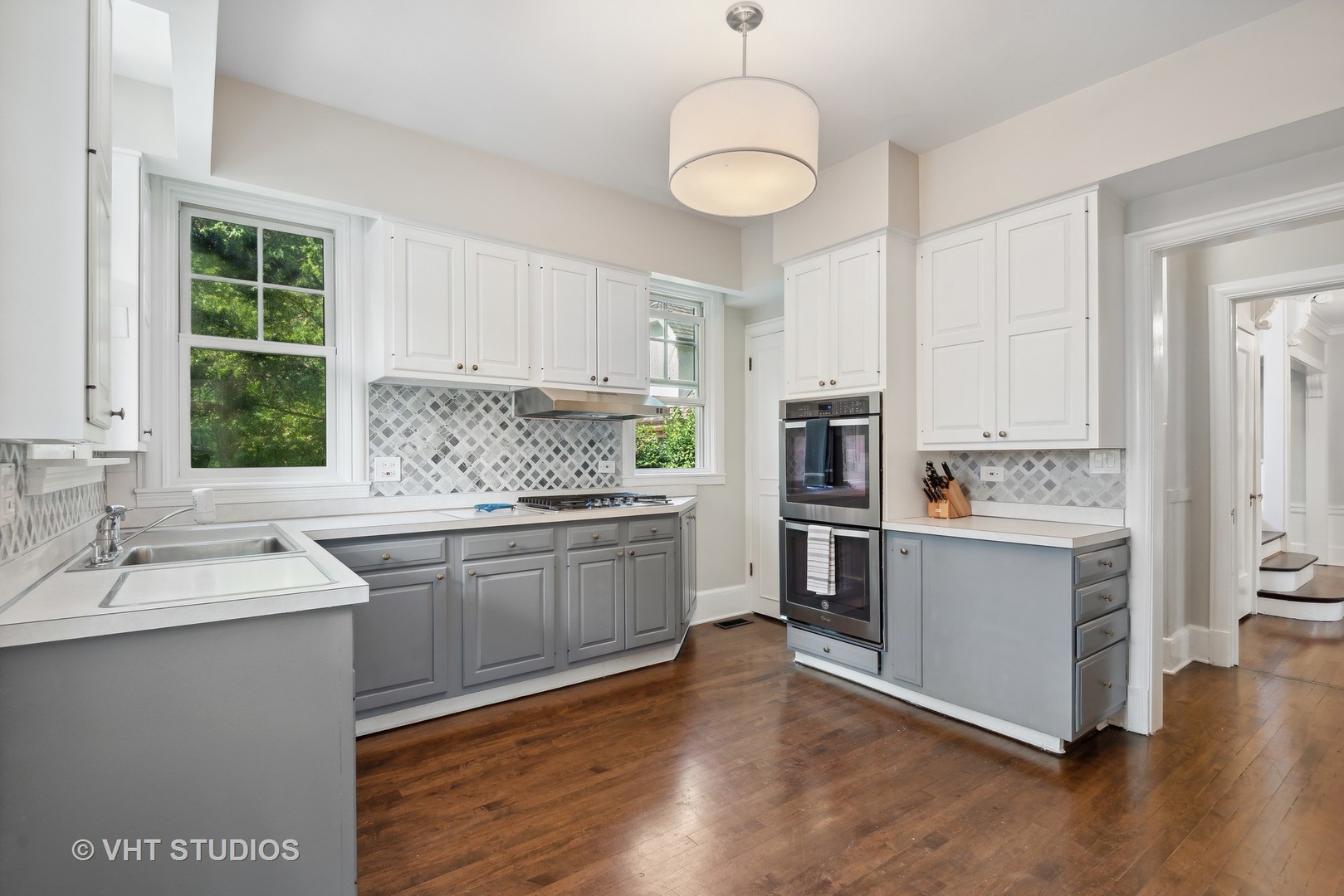 160 Sheridan Road Glencoe, IL 60093 - Photo 12 of 42 a kitchen with stainless steel appliances granite countertop a sink stove and refrigerator