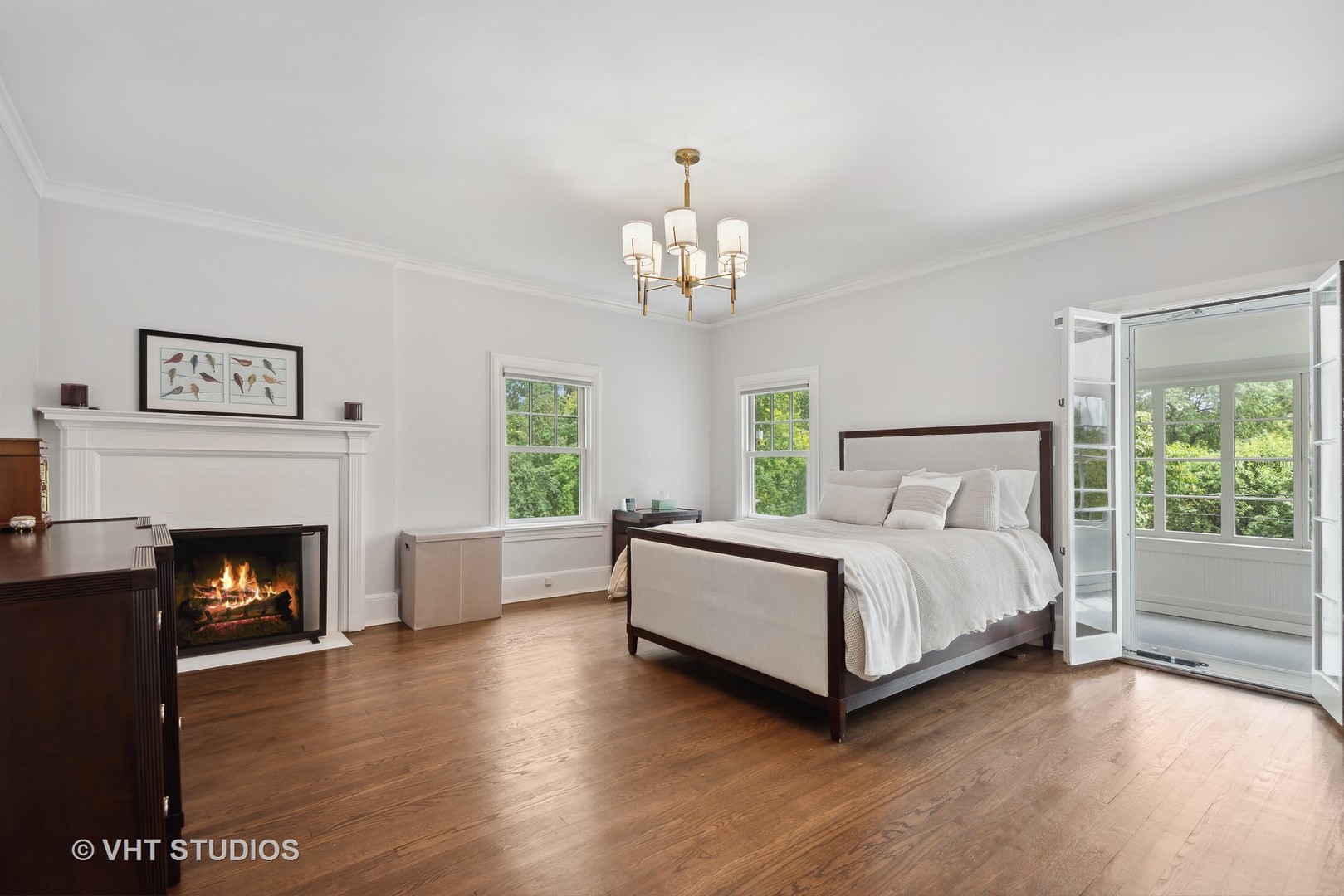 160 Sheridan Road Glencoe, IL 60093 - Photo 18 of 42 a spacious bedroom with a bed and a fireplace