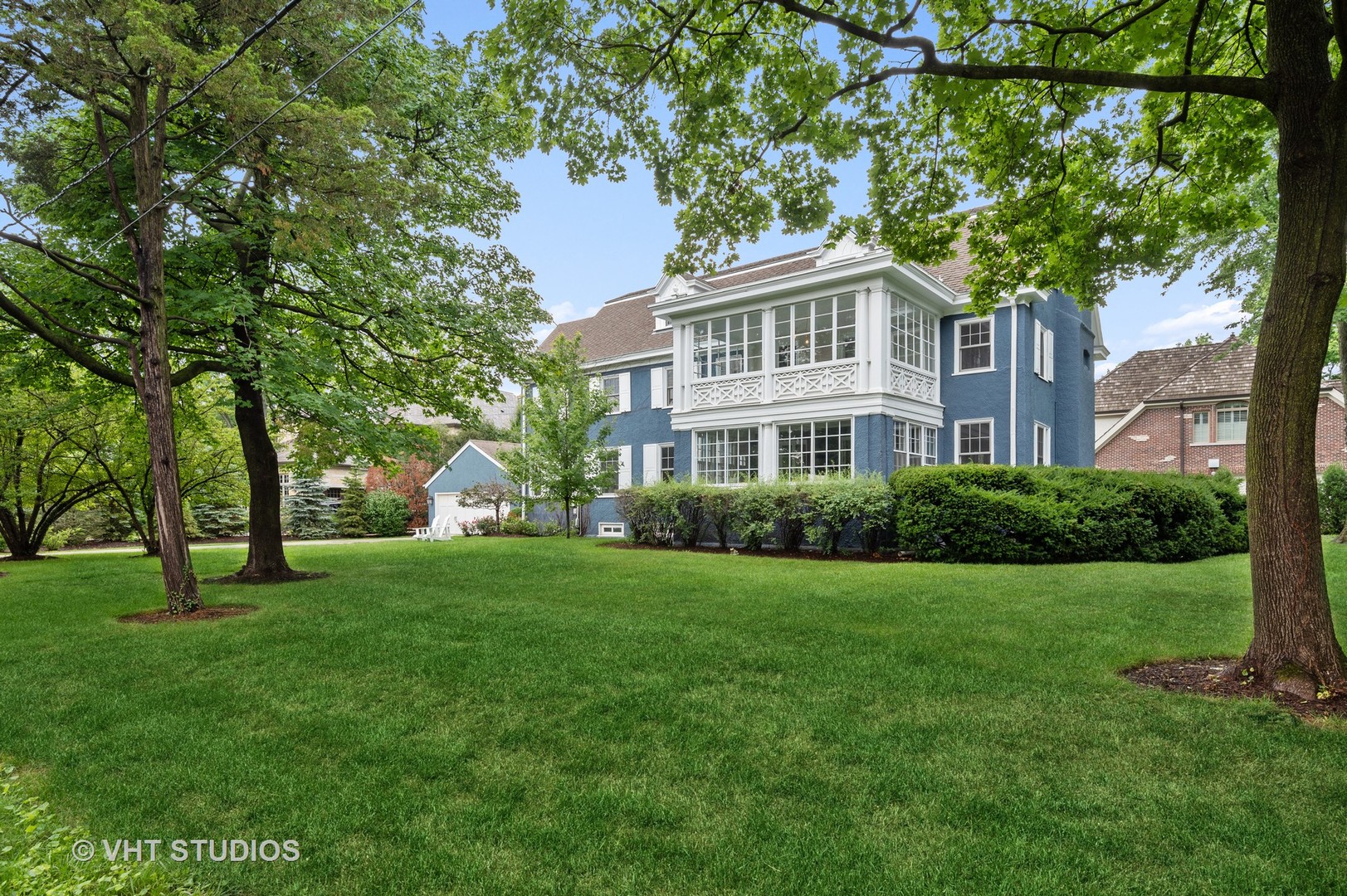 160 Sheridan Road Glencoe, IL 60093 - Photo 32 of 42 a front view of a house with a yard