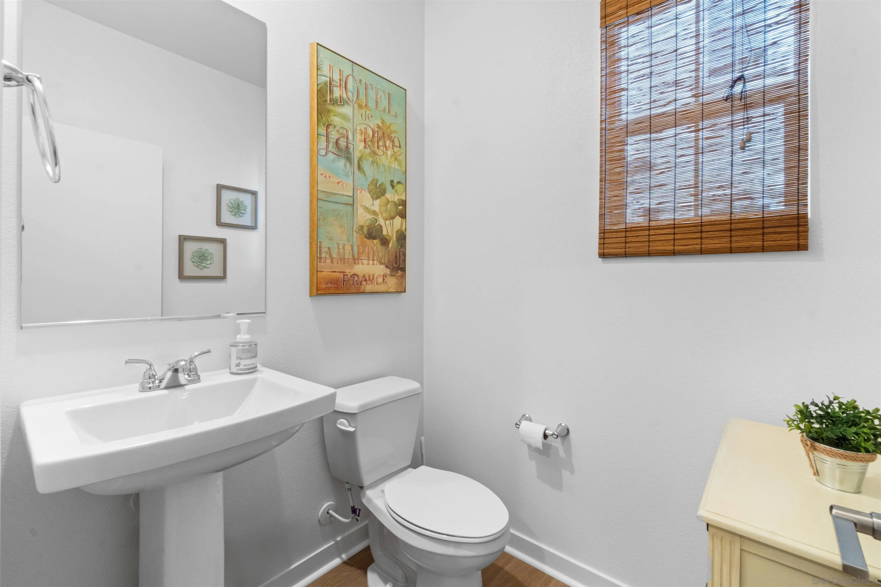 211 Canopy Trails Place Fallbrook, CA 92028 - Photo 12 of 29 a bathroom with a sink a mirror and a toilet
