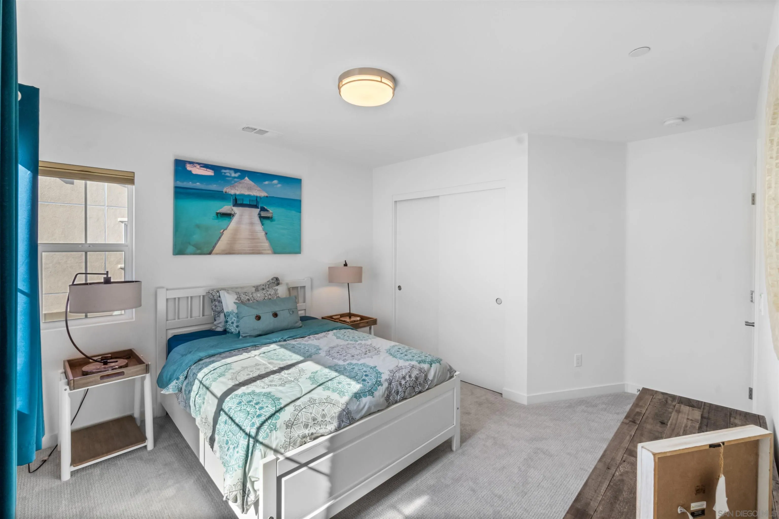 211 Canopy Trails Place Fallbrook, CA 92028 - Photo 16 of 29 a bedroom with a bed and a painting on the wall