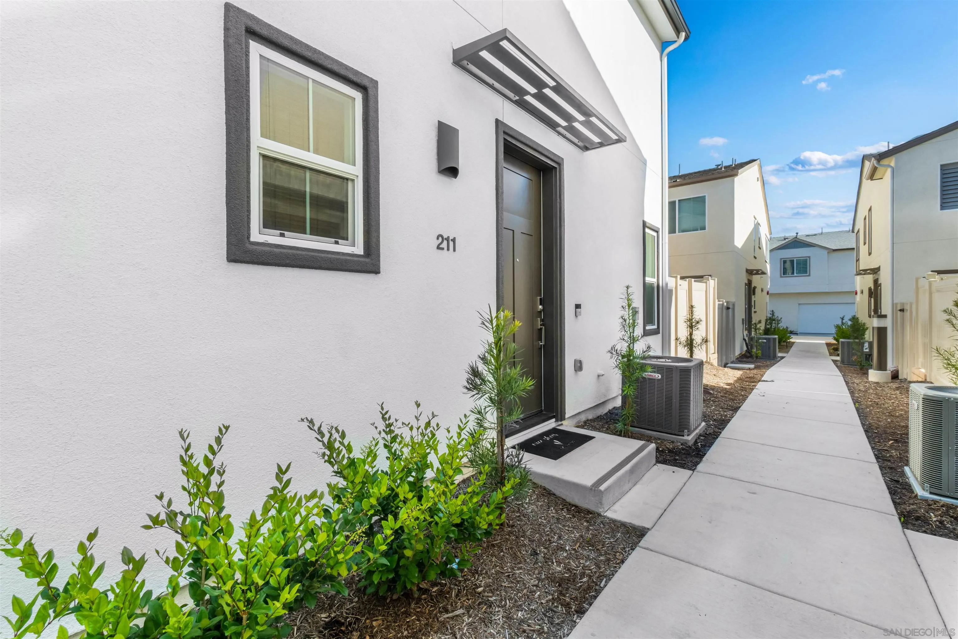 211 Canopy Trails Place Fallbrook, CA 92028 - Photo 2 of 29 a view of a potted plants in back of a building