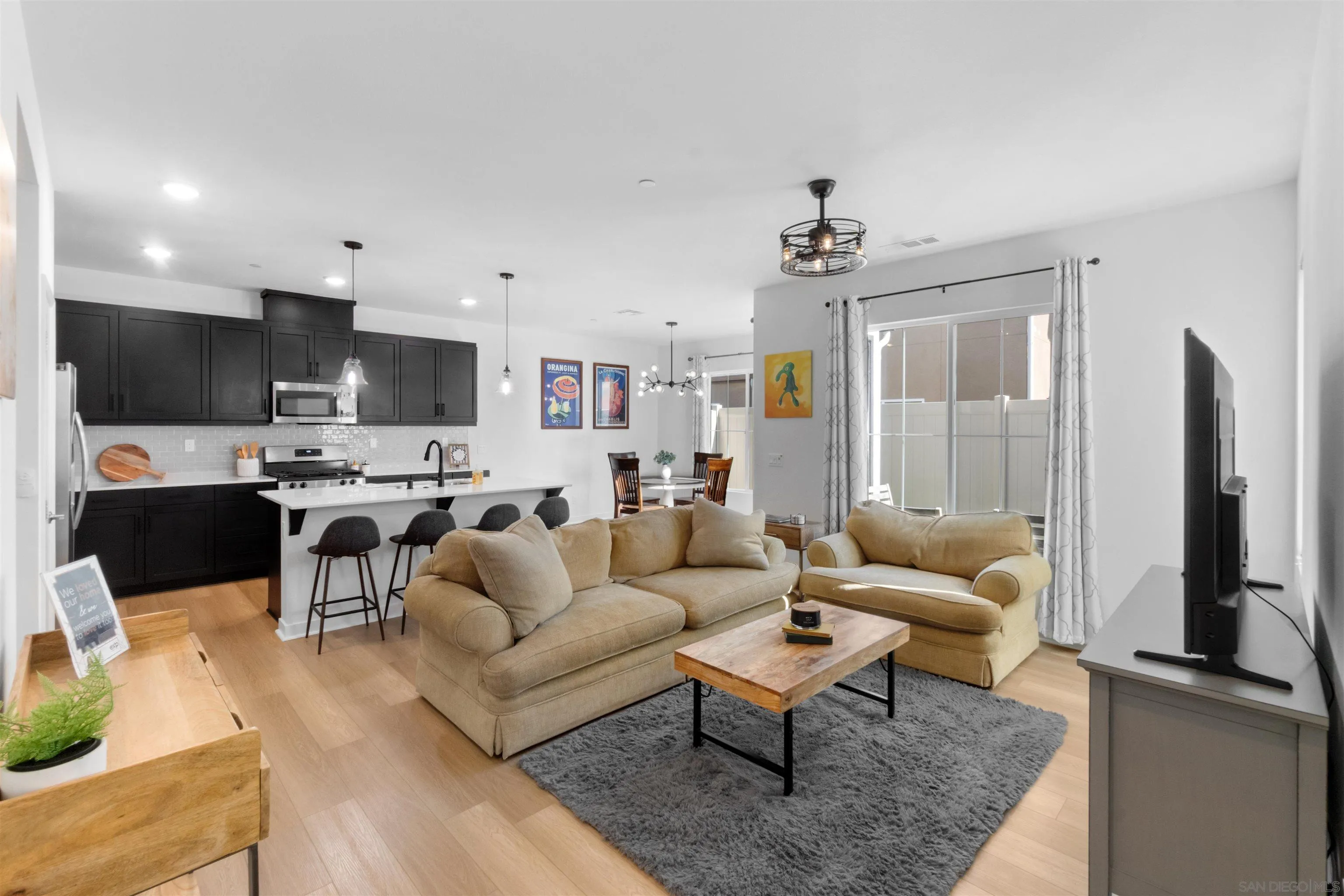 211 Canopy Trails Place Fallbrook, CA 92028 - Photo 3 of 29 a living room with furniture and a flat screen tv