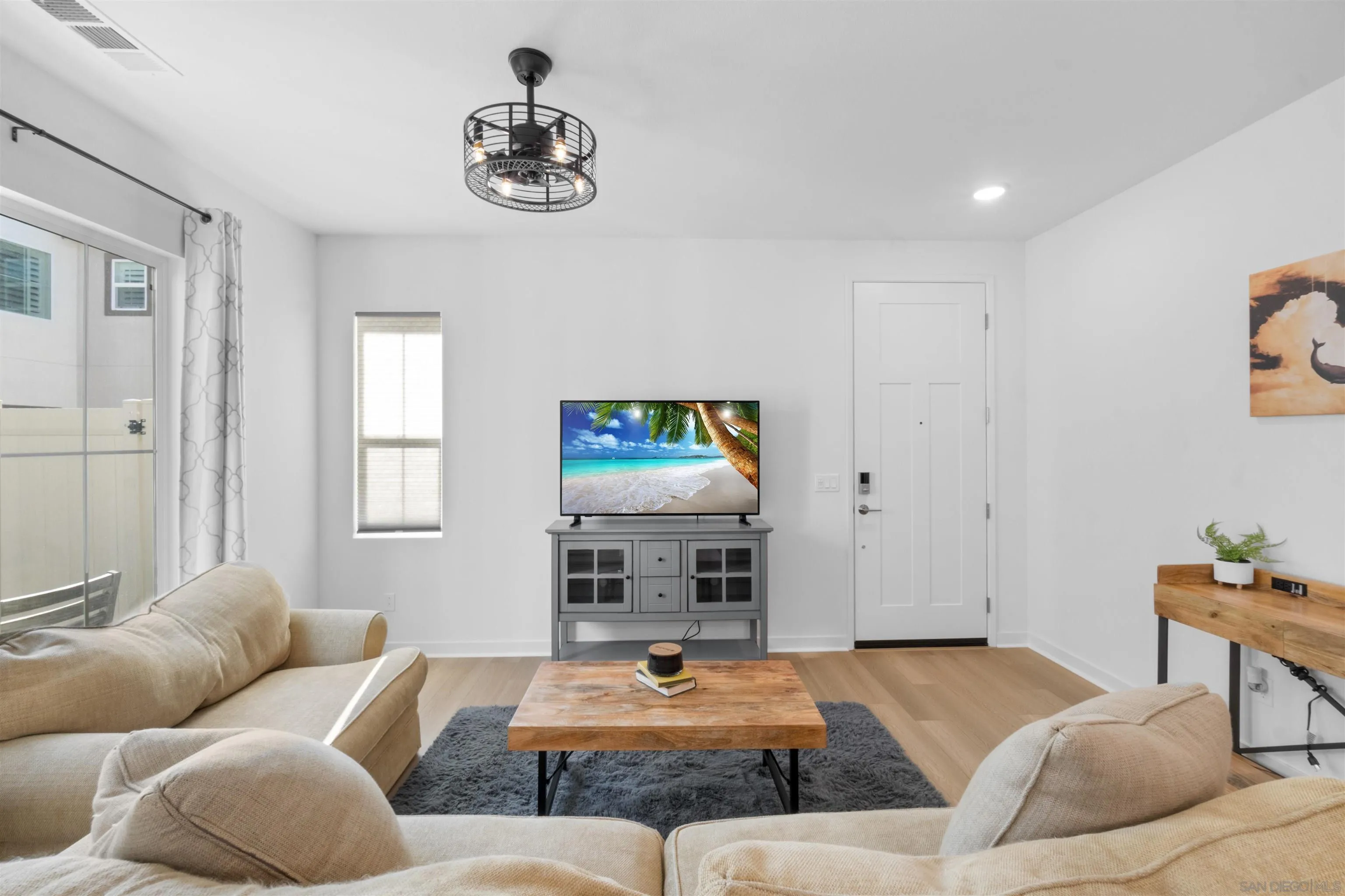 211 Canopy Trails Place Fallbrook, CA 92028 - Photo 5 of 29 a living room with furniture and a flat screen tv