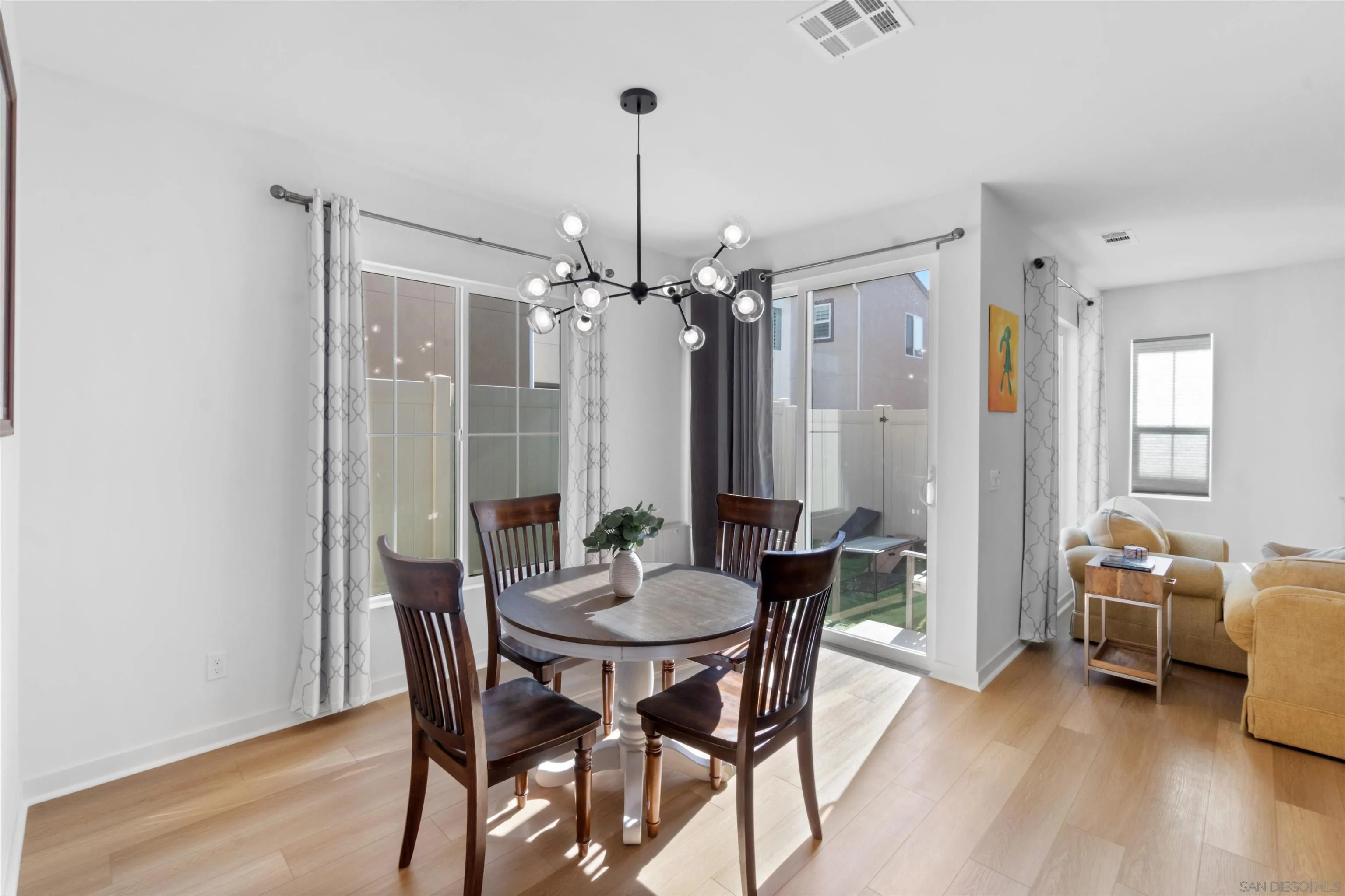 211 Canopy Trails Place Fallbrook, CA 92028 - Photo 10 of 29 a view of a dining room with furniture and wooden floor