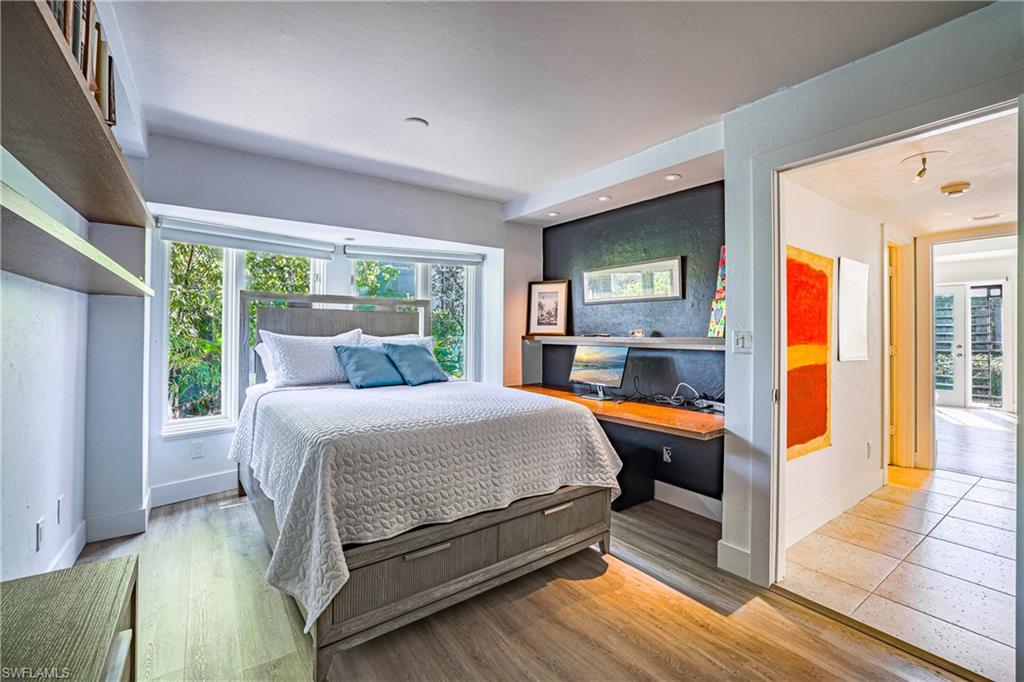536 Turtle Hatch Road Naples, FL 34103 - Photo 22 of 28 Bedroom with light wood-type flooring and an office area