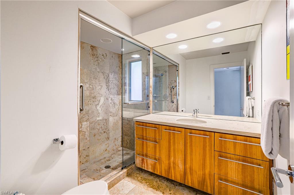 536 Turtle Hatch Road Naples, FL 34103 - Photo 23 of 28 Full bathroom featuring vanity, a marble finish shower, and recessed lighting