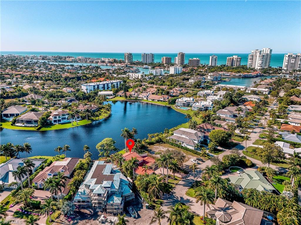 536 Turtle Hatch Road Naples, FL 34103 - Photo 27 of 28 Aerial view of residential area featuring a large body of water